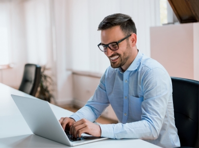 Image-happy-young-businessman-using-laptop-his-office-desk (2)